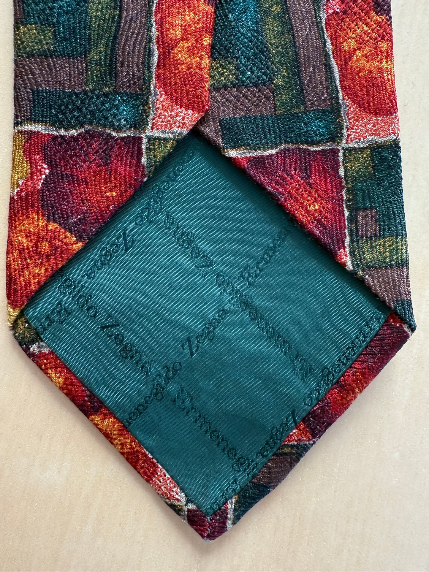 Cravatta Ermenegildo Zegna jacquard geometrico e floreale