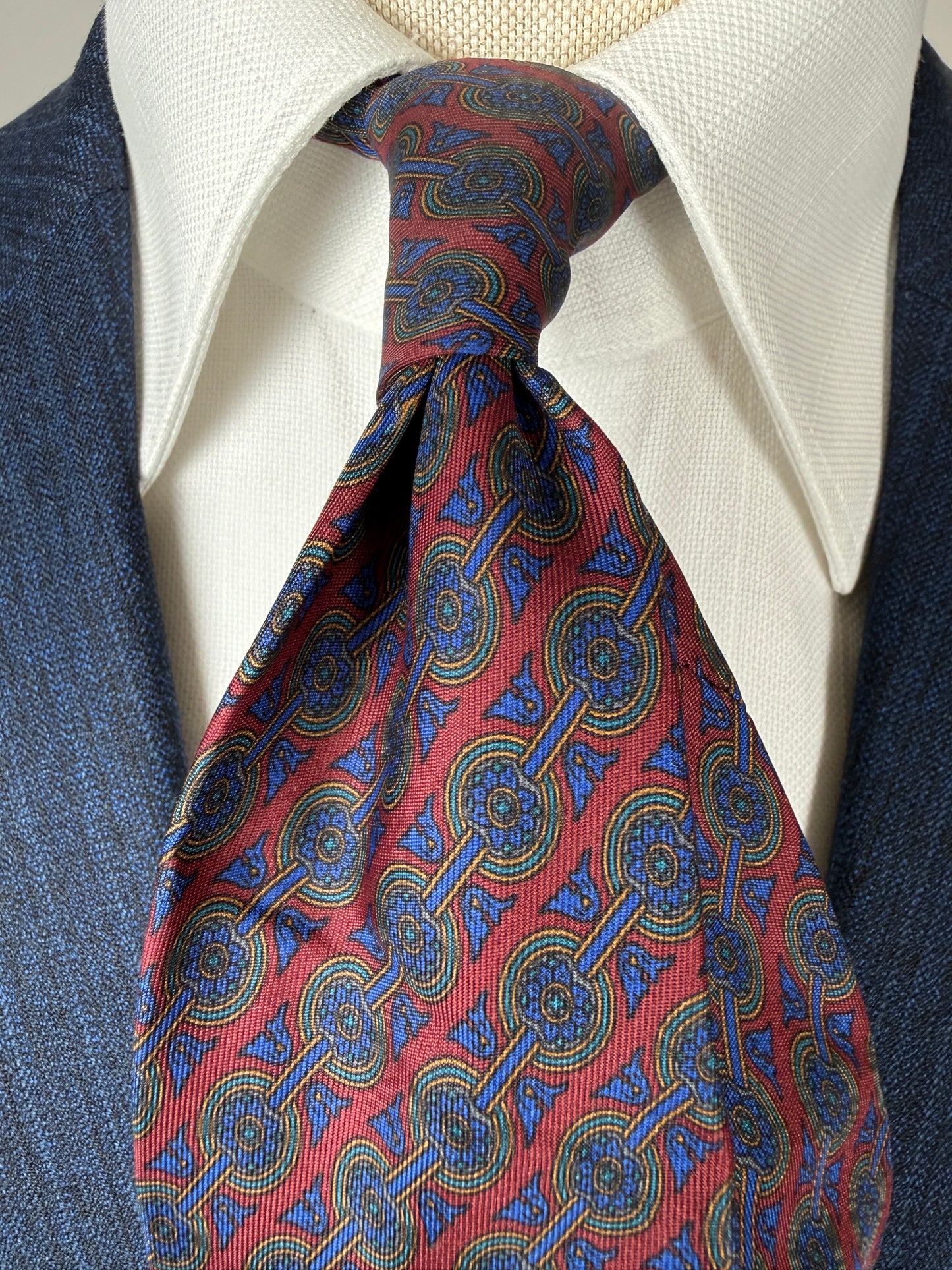 Cravatta Ferragamo micro fantasia blu e bordeaux