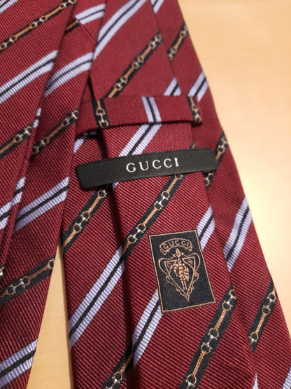 Cravatta Gucci regimental bordeaux fantasia horsebit