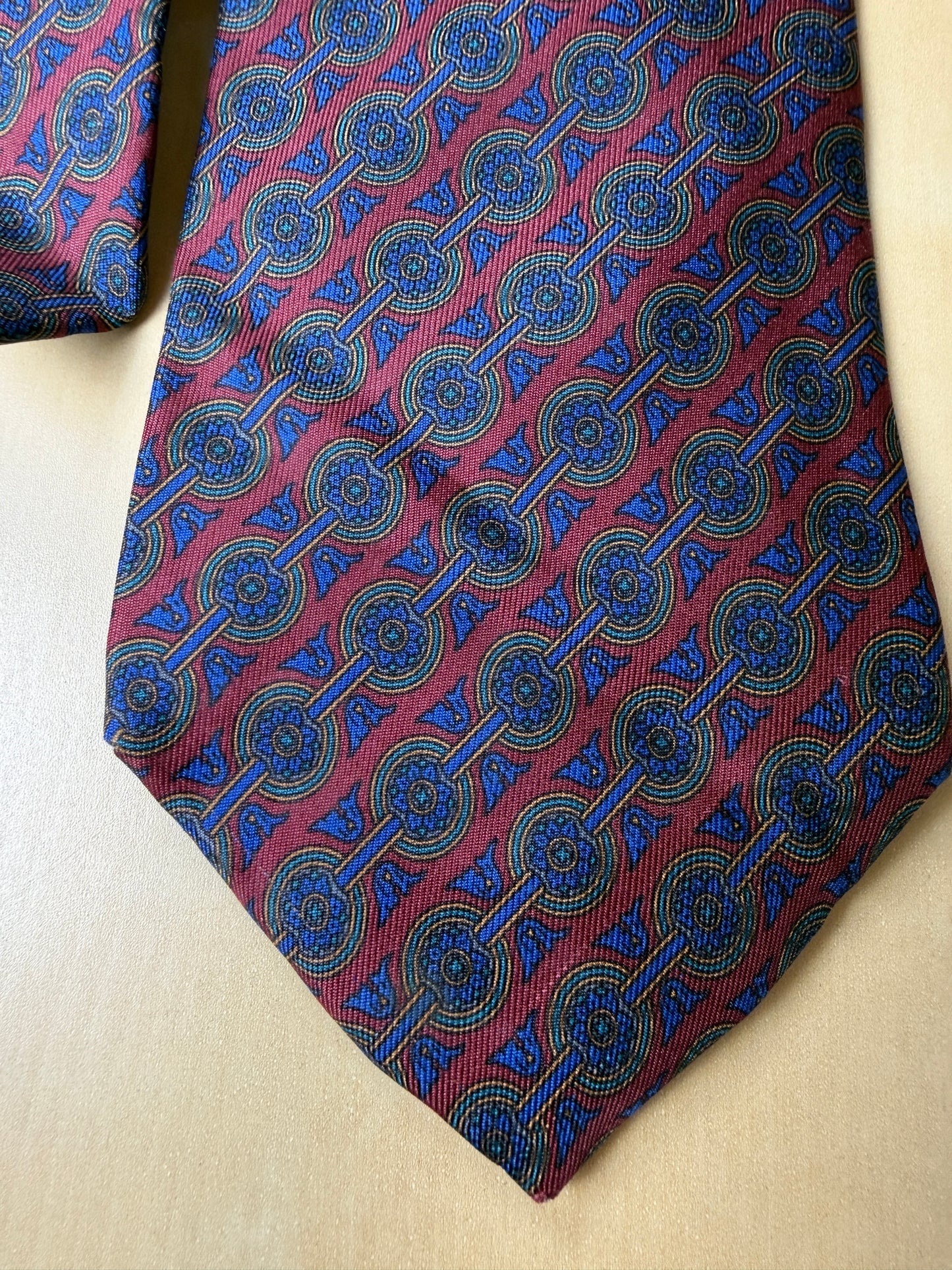 Cravatta Ferragamo micro fantasia blu e bordeaux