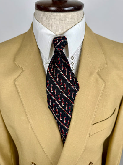 Cravatta Yves Saint Laurent anni ‘70 jacquard con loghi
