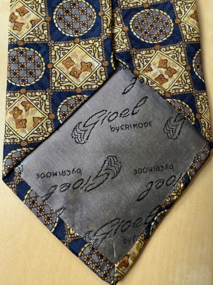 Cravatta anni ‘80 jacquard quadri e medaglioni