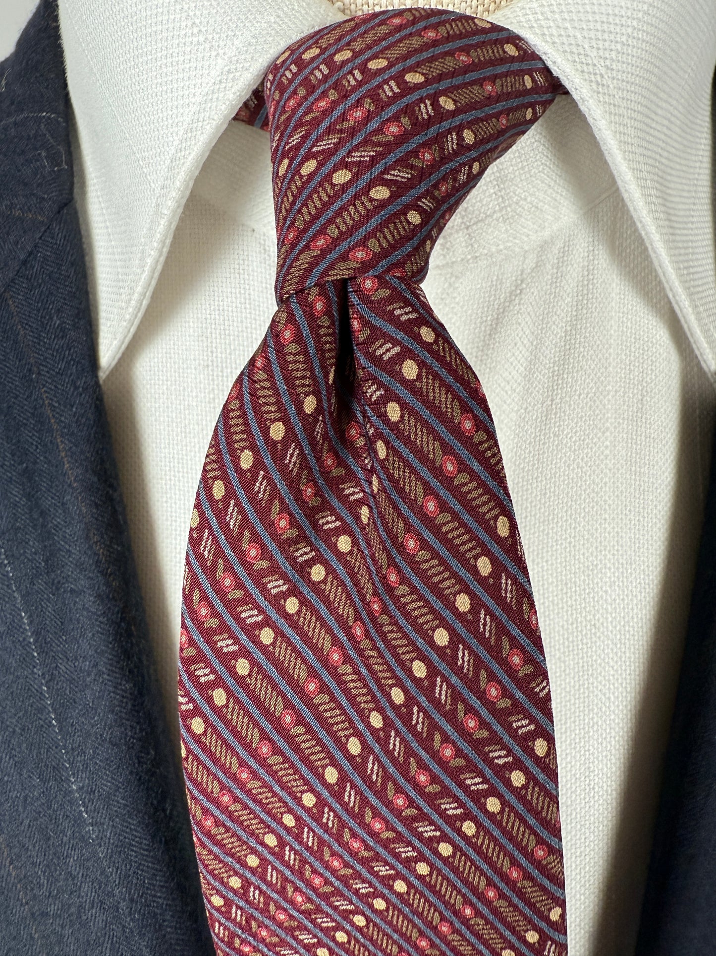 Cravatta Yves Saint Laurent fantasia geometrica vinaccia