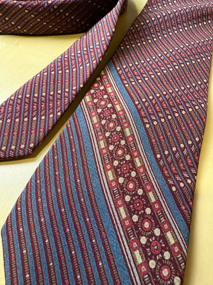 Cravatta Yves Saint Laurent fantasia geometrica vinaccia