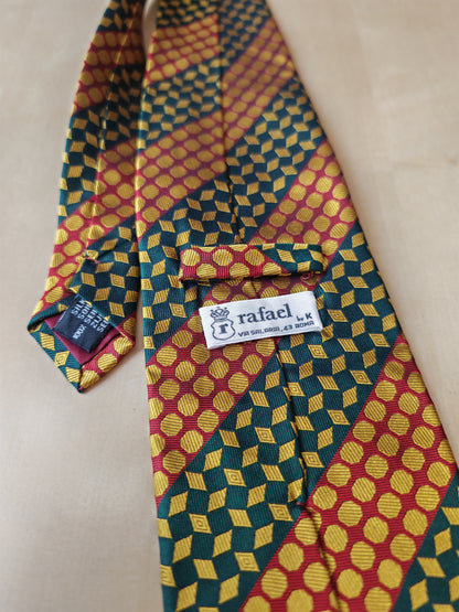 Cravatta geometrica rossa verde e oro