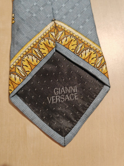 Cravatta Versace jacquard con fantasia barocca oro