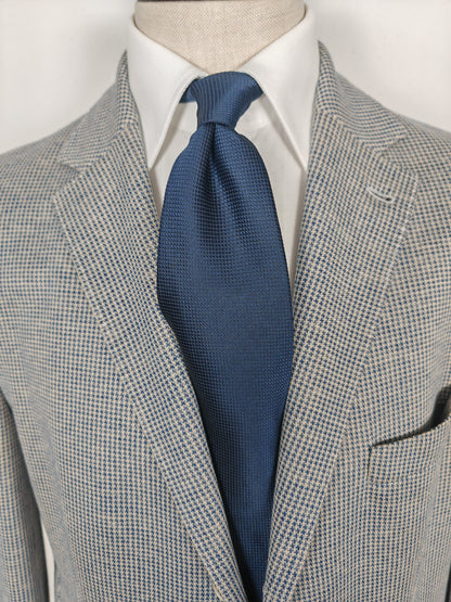 Cravatta blu tinta unita trama quadrettini