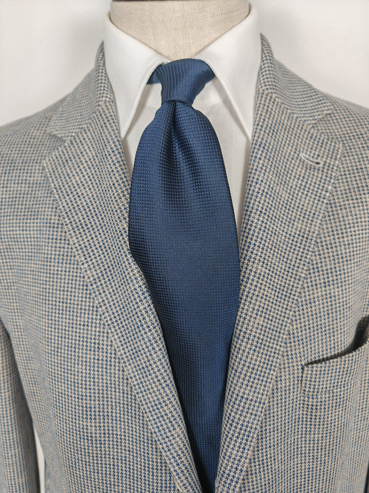 Cravatta blu tinta unita trama quadrettini